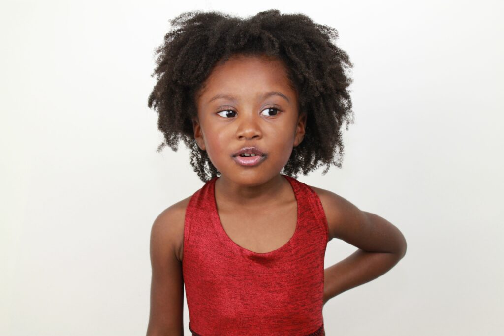 young girl in red tank top